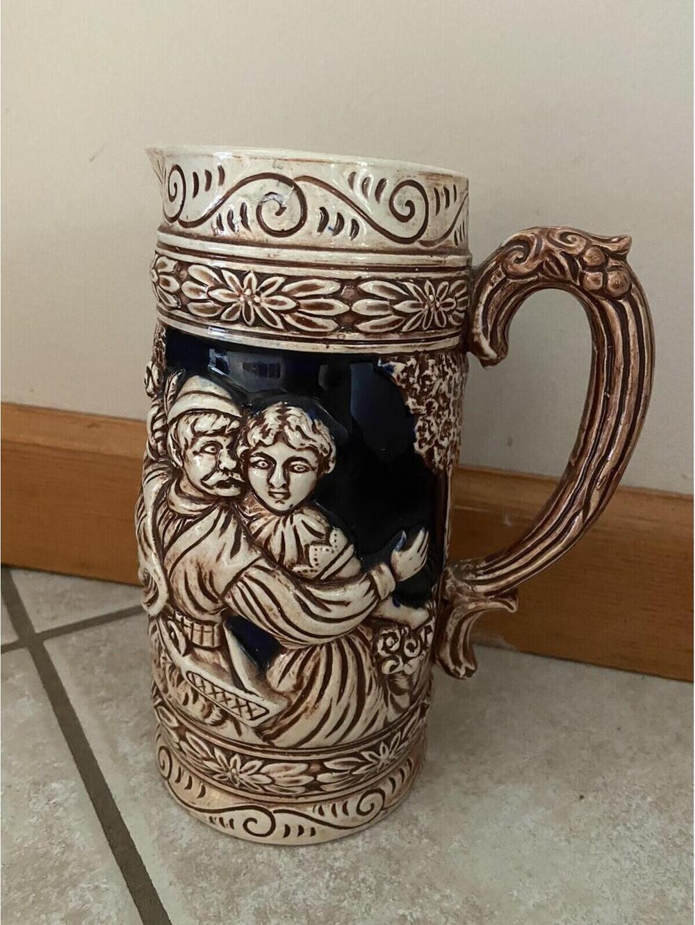 Vintage Ceramic Beer Stein Tankard with Relief Scenes and Ornate Handle